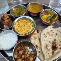 Veg Thali w naan, chickpea and lentils, raita. pakora, spinach paneer, dal, rice and veg curry at Namaste in Bayonne