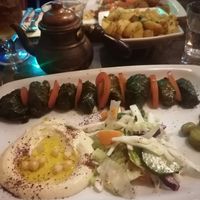 Stuffed grape vine leaves Platter with Syrian chips. Behind is Falafel platter at Damascus Gate in Dublin