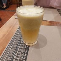 Fresh apple, pinneapple, orange juice at Canadu in Malaga