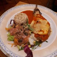 Stuffed aubergine with brown rice and salad at Canadu in Malaga