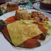 Stuffed aubergine with rice, nuts, vegan cheese at Canadu in Malaga