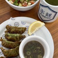 Tofu avocado bowl, genmai tea, and vegan gyoza  at RAKKAN Ramen - DTLA in Los Angeles