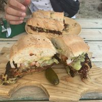 Torta chorizo (further away), torta Cubana (closer)  at Huitzilli Saludable in Merida