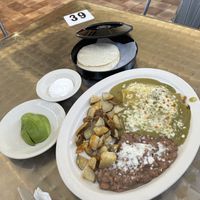Huevos rancheros (ovo-lacto vegetarian) with green Chile sauce, sour cream and sliced avocado at Habanero's Fresh Mex in Las Cruces