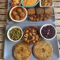Vegan platter (top) and seitan hamburger (bottom)  at El Vegetariano de la Alcazabilla in Malaga