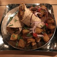 Super tasty vegan wrap and chips. at Mowgli - Grand Central in Birmingham