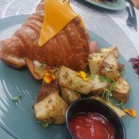 Croque Monsieur Croissant w/ roasted potatoes at L'Artisane Creative Bakery in Coral Gables
