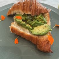 Plain croissant with avocado at L'Artisane Creative Bakery in Coral Gables