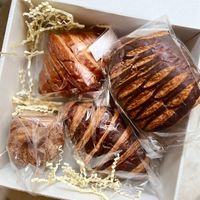 Assorted croissants box: Nocciolata, Guava (not pictured), Pain Au Chocolat, Cookie Butter and Cruffin.   at L'Artisane Creative Bakery in Coral Gables
