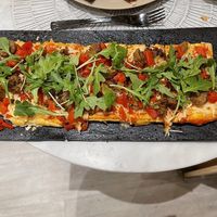 Italian sausage flatbread at L'Artisane Creative Bakery in Coral Gables