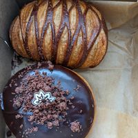 Pain au chocolat (top) and Boston cream donut (bottom) at L'Artisane Creative Bakery in Coral Gables