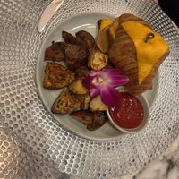 Croque Monsieur Croissant with Roasted potatoes .  at L'Artisane Creative Bakery in Coral Gables