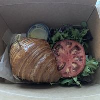 VTE Croissant sandwich with side salad at L'Artisane Creative Bakery in Coral Gables
