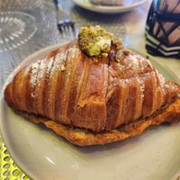 Pistachio croissant at L'Artisane Creative Bakery in Coral Gables