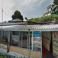 front with gate open, means they're open :) at No Name Restaurant in Kandy