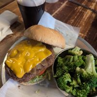 Impossible burger with vegan cheese, sauteed mushrooms and onions. Side of sauteed broccoli at Lavergne's Tavern in Berwyn