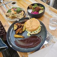 Pan fried Raviolis and Burger with amazing homemade mayo, bacon, avocado and more. Delicious baked potatoes. at Les Bols d'Antoine in Paris
