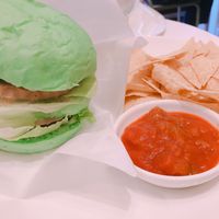 Soy meat and avocado burger with tortilla chips and salsa  at Fabius Cafe in Tokyo