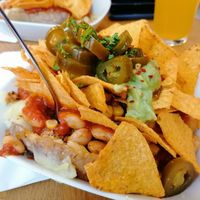 Mexicano potato - vegan chilli, sweetcorn, jalapeños, guacamole and topped with nachos. One of the best potatoes I've ever eaten at Erdapfel in Hamburg