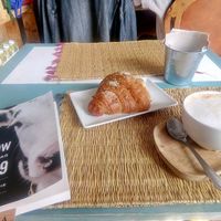 Vegan croissant and latte at Grow Café in Tarifa