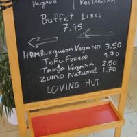The sandwich board listing daily specials. at Loving Hut in Malaga