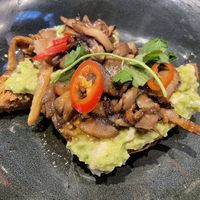 Teriyaki mushrooms on avocado toast   at LHR - Wagamama - T5 in West London