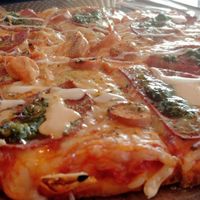 Pepperoni & sausage pizza at Back2Nature Vegan Cafe in Brighton