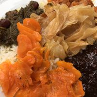 My plate with the 5 vegan combo items atop the saffron rice. Yum! at Safran in Berlin