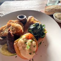 Big Breakfast Stack-Sweet potato and taro hash browns, crispy mushroom, avocado, grilled tomato, jackfruit sausage, ruccula and papaya chutney, pickle. at Zest Ubud in Ubud