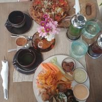 jackfruit gluten free pizza & a plate with potatoes, dips, eggplant, crisps and fresh vegetables at Zest Ubud in Ubud