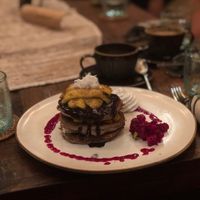 Pancake stack with caramelised banana, chocolate and dragonfruit sauce  at Zest Ubud in Ubud