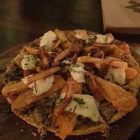 Gluten-free coconut-tapioca based pizza with cashew cheese, mushrooms, jackfruit sausage  at Zest Ubud in Ubud