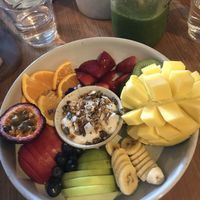 Fruit plate with vegan yogurt and granola at Preach Cafe in Bondi Beach