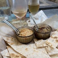 Hummus and babaganoush with drinks on a vibrant patio!  at SAJ in Nice