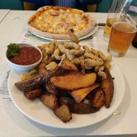 Seitan with potatoes, and a vegan pizza for a friend at Veganeria in Budapest