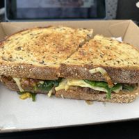 Caramelised onion toastie with mushroom meat, spinach and vegan cheese  at Acai Brothers in Port Melbourne