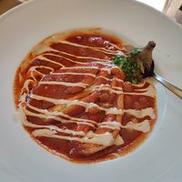 Vegan whole baked eggplant in tomato sauce at Gam-Gam in Venice