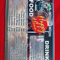 happy hour menu   at the time,  it was 17 pesos to the dollar at El Patio House of Music in Isla Mujeres