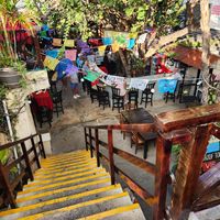 heading downstairs to the lower level restaurant with a separate bandstand, etc at El Patio House of Music in Isla Mujeres