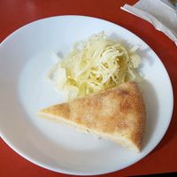Complementary pizza salad and bread  at Vallastadens Pizza Grill in Linkoping