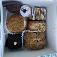 From top left: peanut butter patty; fruit tart; pistachio cake; almond cake; lingonberry coffee cake; peanut butter brownie; coconut caramel cake    at Carina's Bakery in Beaverton