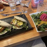 Tofu bao buns and side vegan caesar salad  at Atomica in Kingston