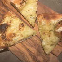 garlic and cheese focaccia starter (there were double the pieces but i was hungry 😬👀)  at Café Piccolina in Aarhus