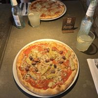 Pizza 105 (principessa) with vegan cheese, vegan salami, artichokes, olives and mushroom  at Café Piccolina in Aarhus