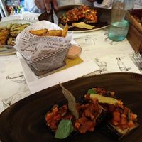 Aubergine with ragout of tofu and courgette in a tomato sauce, fries (I think they were called 'rustic potatos') and small portion of grilled vegetables. at Gourmetteria in Padua