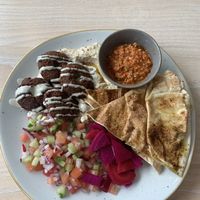South Street Hummus Plate (vg) £7.50
Homemade hummus, fresh falafel, tahini dressing, salad shirazi, vibrant pickles, za’atar flatbread and our spicy red pepper & pumpkin seed m at South Street Kitchen in Sheffield