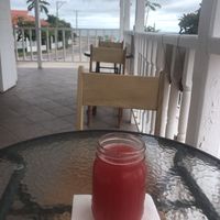 Watermelon Juice with the view in the distance of the Belize sigh  at Martha's Cafe Belize in Belize City