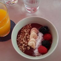 Açai bowl and orange juice at Joma in Vienna