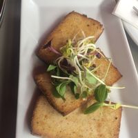 smoked tofu add to salad bowl at Joma in Vienna