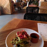 Delicious Vegan matcha avocado waffles at Karibu Cafe in Utrecht